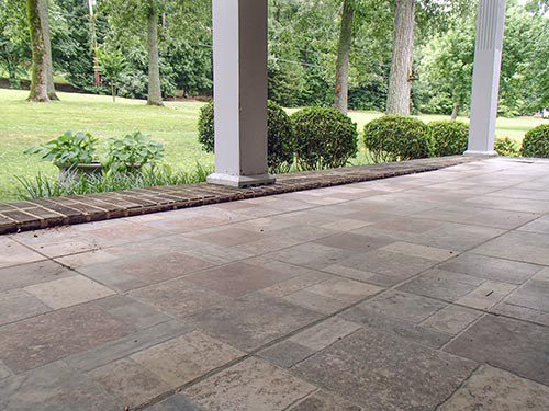 In this example, parking the car in the garage required driving over a major bump. Lifting the driveway apron made parking the garage less of an ordeal.